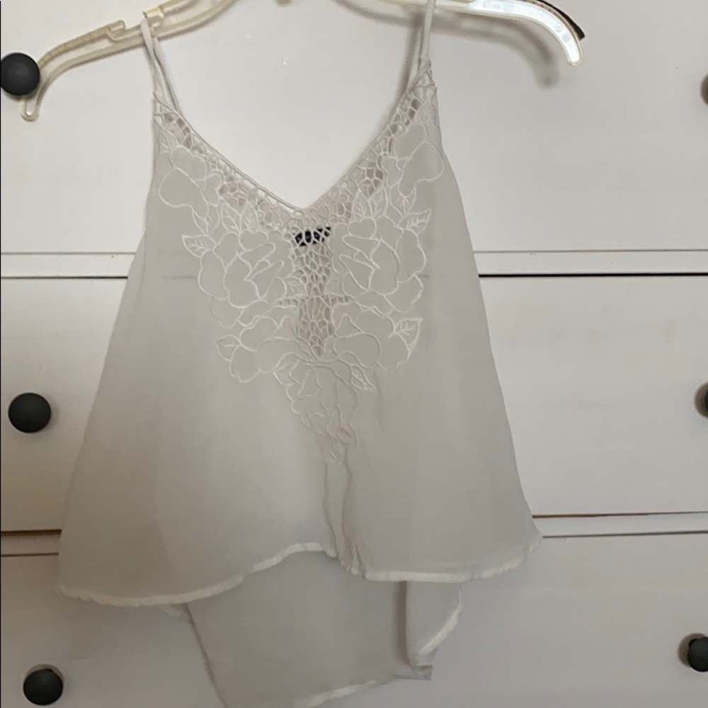 Flowy white top with floral pattern